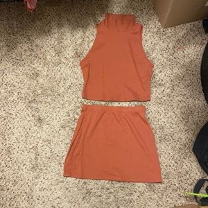 2 piece turtle neck and skirt set. Size medium. Never worn.